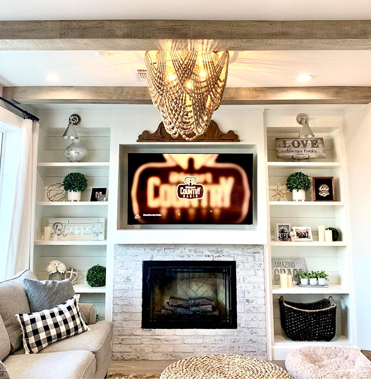 An image of Volterra’s faux wood beams installed in a family room.