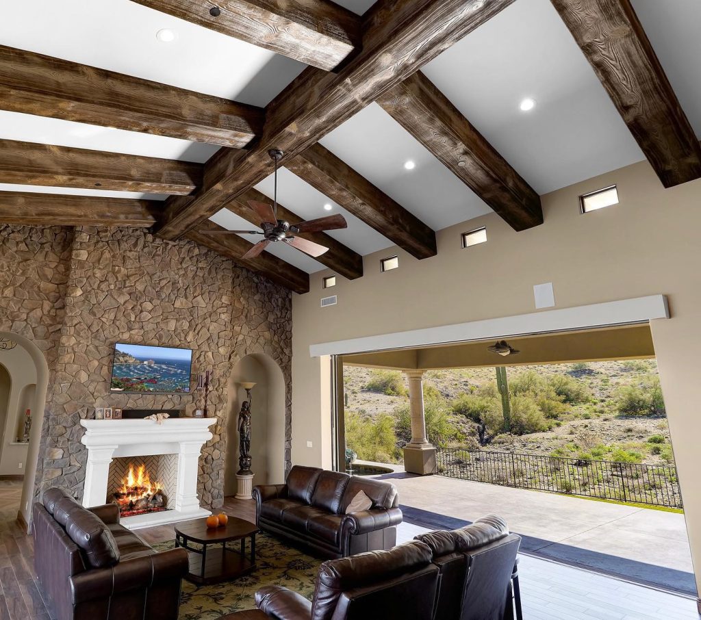 Dark faux wood beams installed in living area